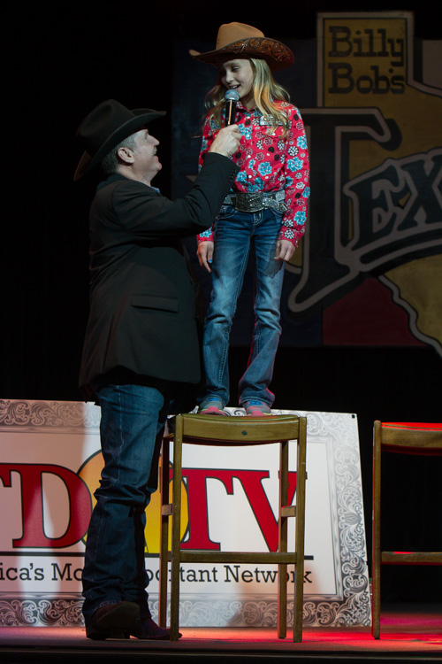 A bidder put up $21,000 to buy space on 9-year-old barrel racer Chayni Chamberlain. 