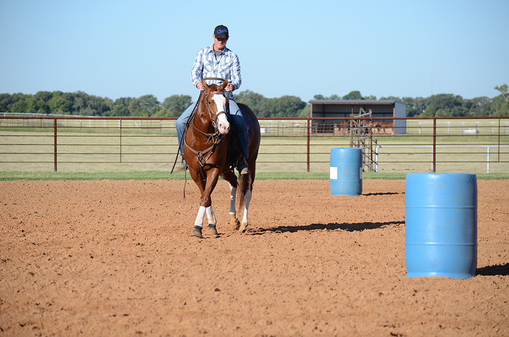 As long as Lovendahl’s hand is up, his horse continues to move on a straight, forward path off of pressure from the inside rein.