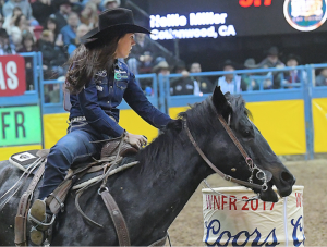 Nellie Miller and Sister turning a barrel at the NFR