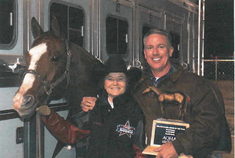 Mary Burger standing with Rare Fred and Ron Martin after winning the 2006 WPRA world championship