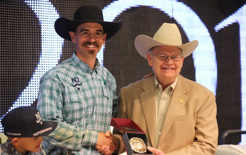 Nick Dowers accepting buckle from Dr. Blodgett at Road to the Horse