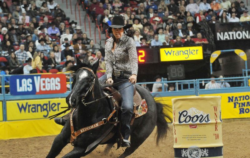 Nellie Miller and Blue Duck turning a barrel at the 2010 NFR