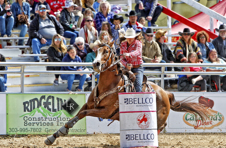 Brittany Pozzi Tonozzi coming around the barrel at the Elizabeth Stampede
