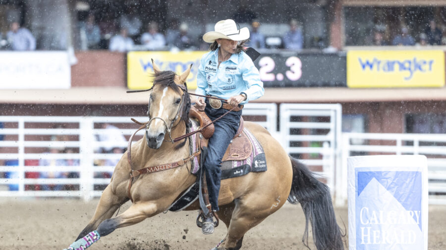Lisa Lockhart and Rosa turning the first barrel at Calgary