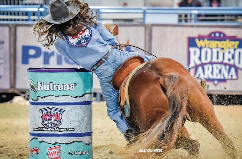 barrel racer rounding the barrel at junior world finals in 2018