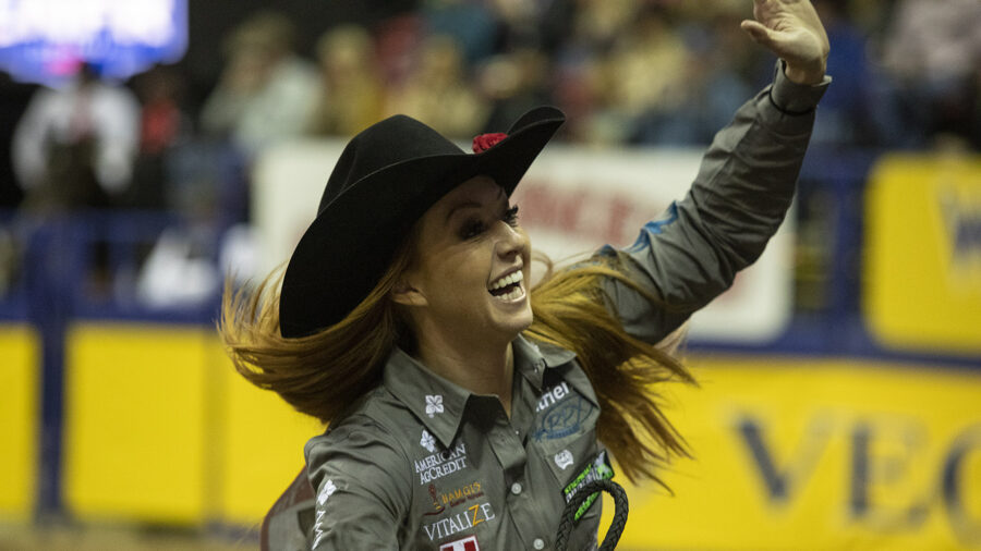 Emily Miller waving during a victory lap