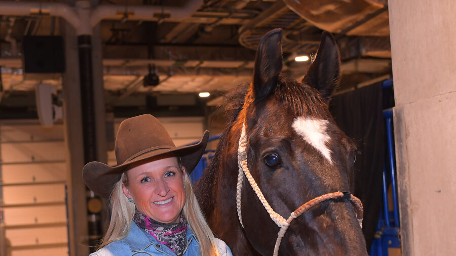 Ivy Hurst standing with Top Of The Roc at the Fort Worth Stock Show Rodeo