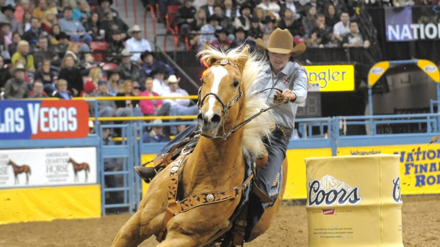 Brittany Pozzi Tonozzi and Yeah Hes Firen turning a barrel at the NFR