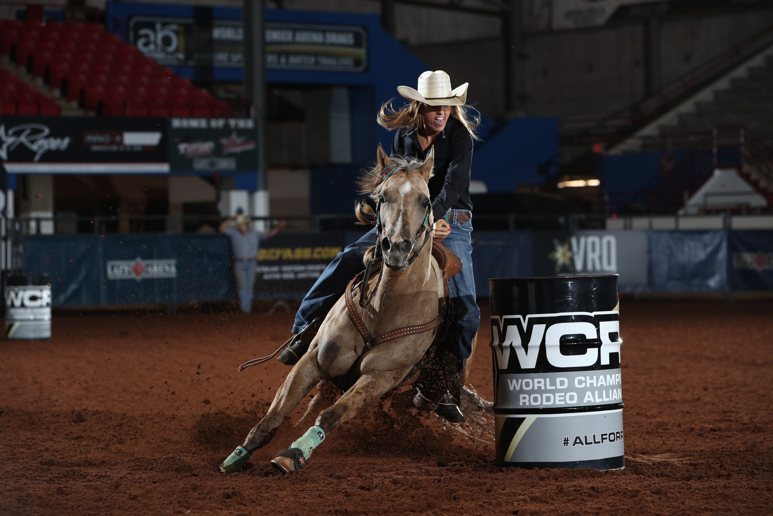 Michelle Darling turning the second barrel at the WCRA Stampede at the E