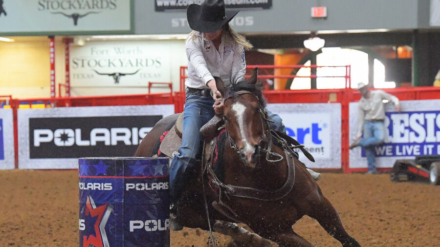Sabra O'Quinn in the money riding her barrel horse