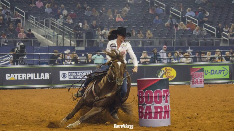 Hallie Hanssen and Tres Movidas turning a barrel at the Women's Rodeo World Championship