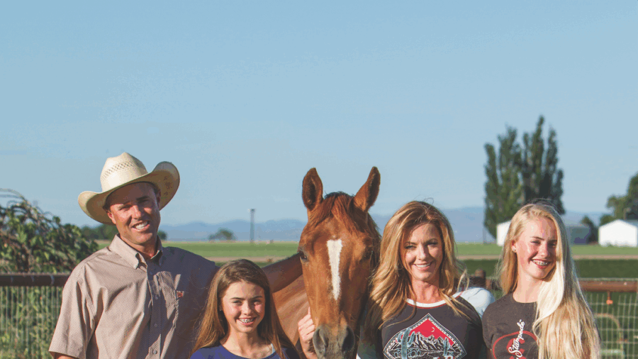 The Telford Family standing together in a field