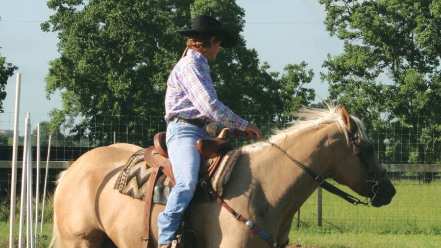 Marcheta Garrett working her horse