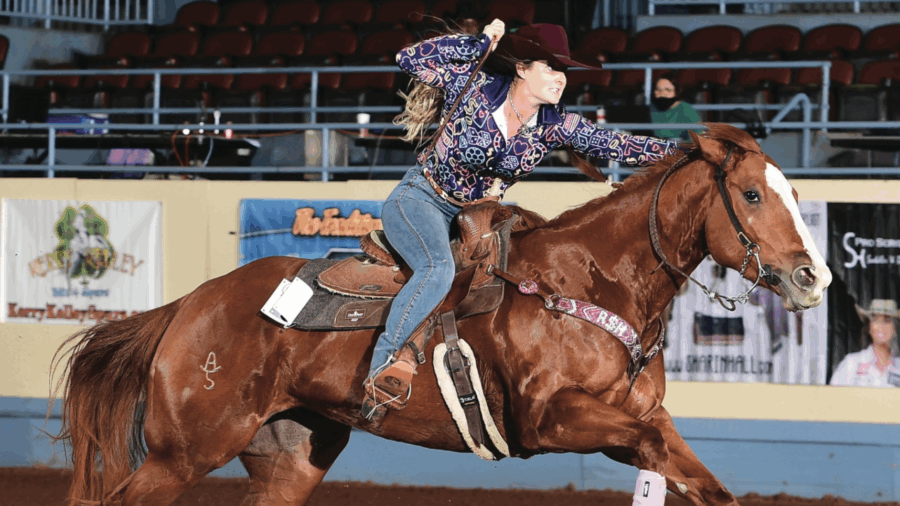 barrel racer on horse running home from third barrel