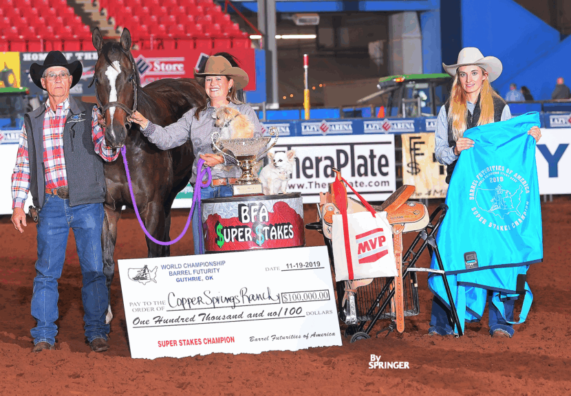 Leslie Willis in SuperStakes awards photo with horse and dog