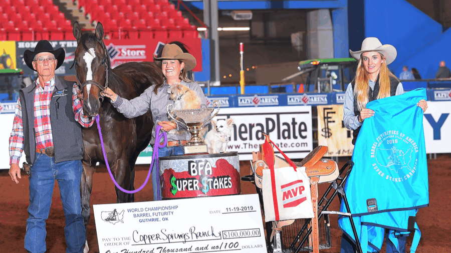 Leslie Willis in SuperStakes awards photo with horse and dog