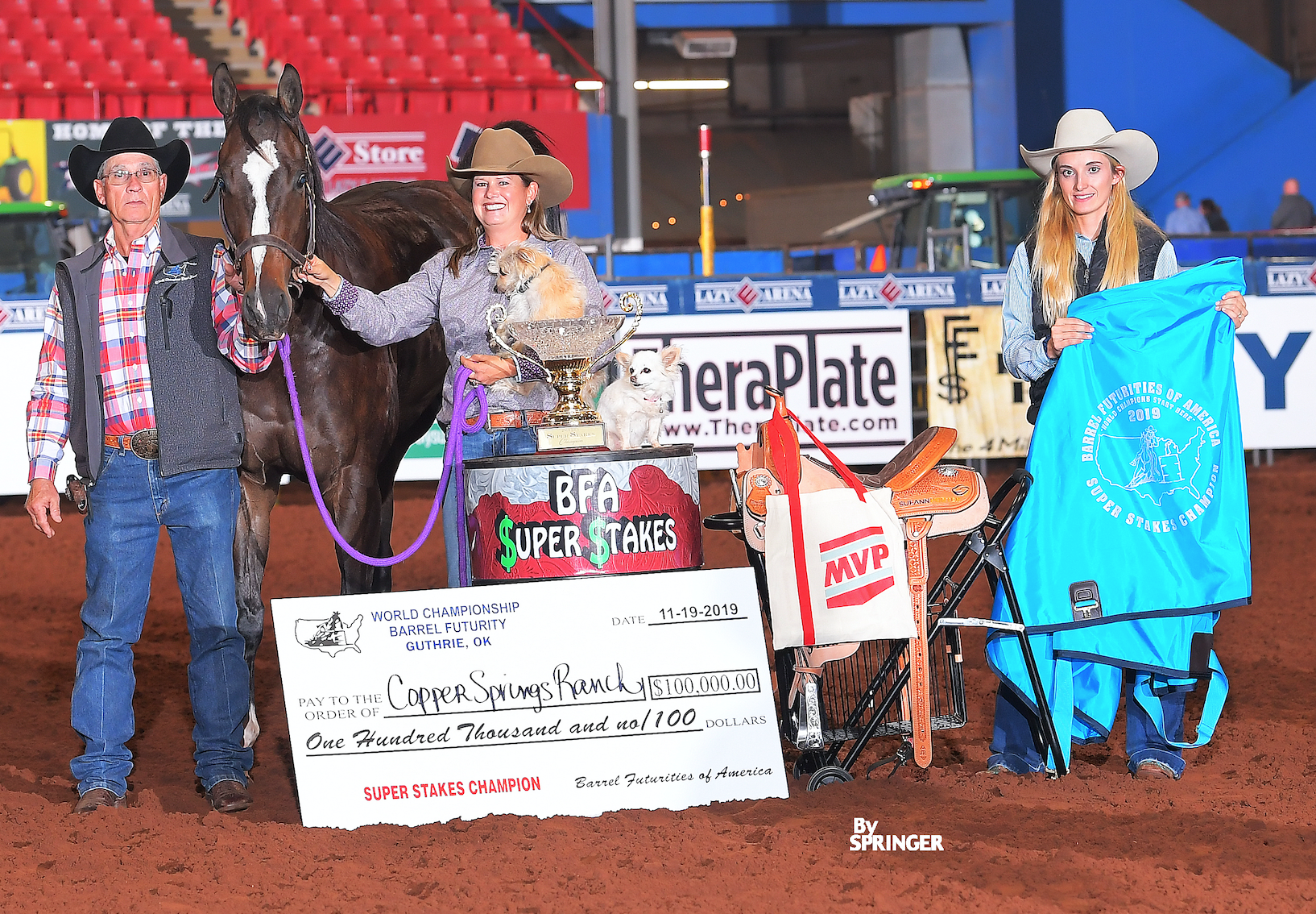 Leslie Willis in SuperStakes awards photo with horse and dog