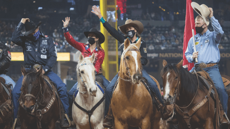 cowgirls and cowboys on horses wearing masks