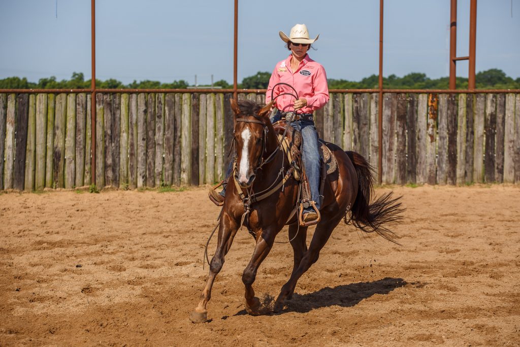 girl riding horse straight