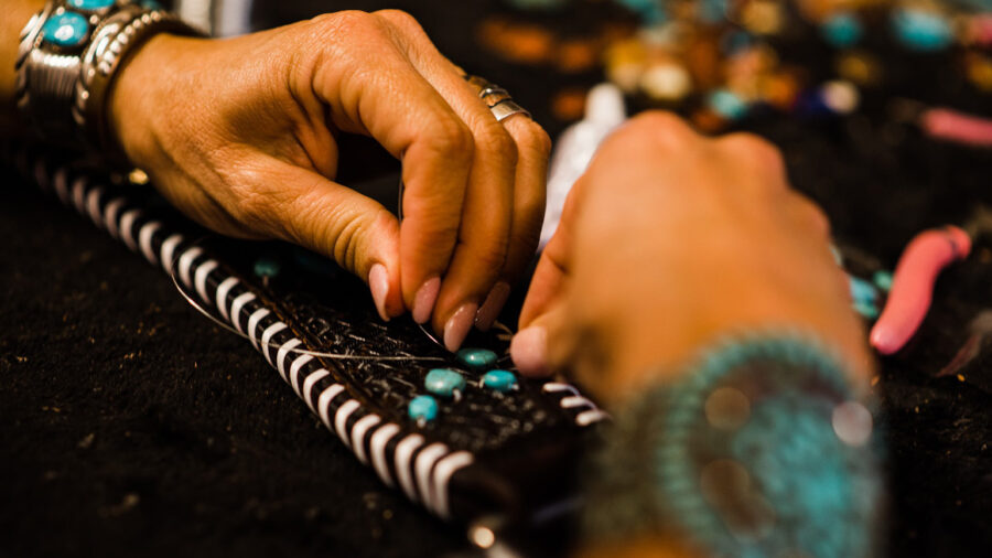 Katie Weaver's hands of Western Dove beading a breast collar