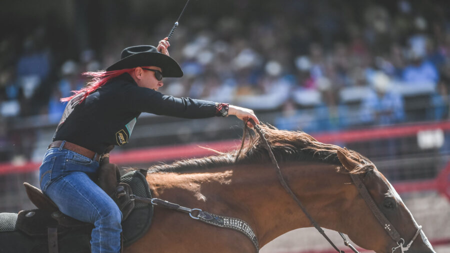 Leslie Smalygo runs Gus across the finish line in Cheyenne