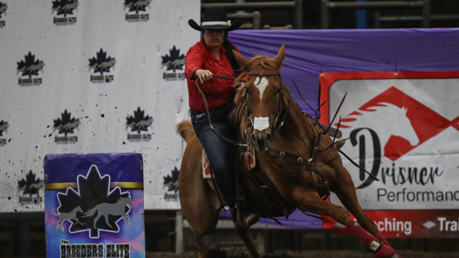 Robyn Hoover turns barrel on horse