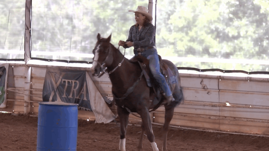 a. Jyme Beth Powell demonstrates how she prefers to approach, turn, leave and finish a barrel turn.
