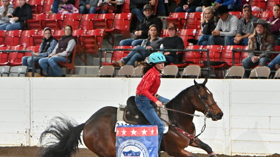 Nina Shirey turns first barrel in All American Quarter Horse Congress Barrel Racing Sweepstakes