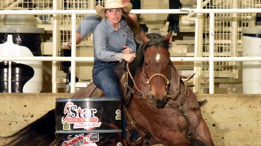 Hailey Kilgore turns a barrel on Sophie Goldseeker at the Lucky Dog race.