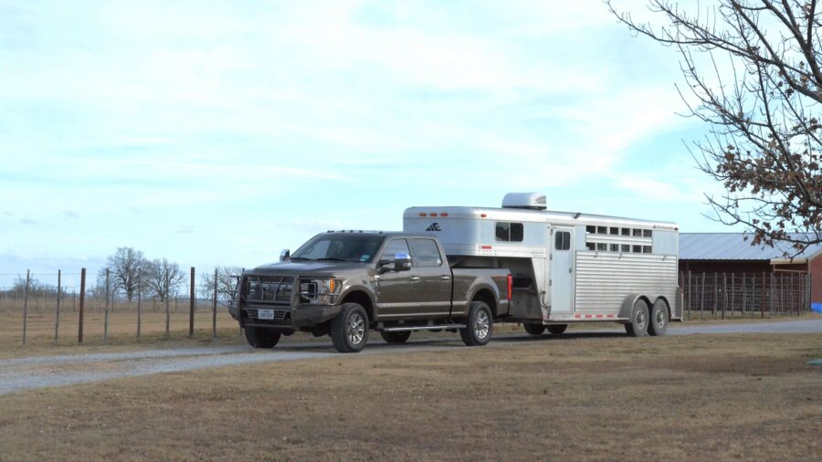 Grey ford truck hooked up to a livestock trailer. Photo by Kailey Sullins