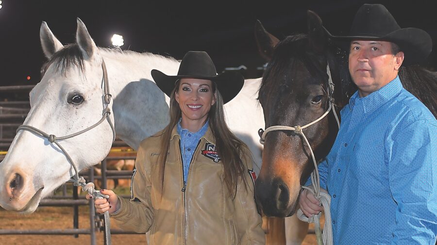 Kassie Mowry and Michael Boone with horses at the 2023 NFR. Photo by Kenneth Springer
