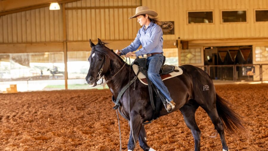 Trainer Caroline Boucher on a horse. Photography by Abigail Boatwright
