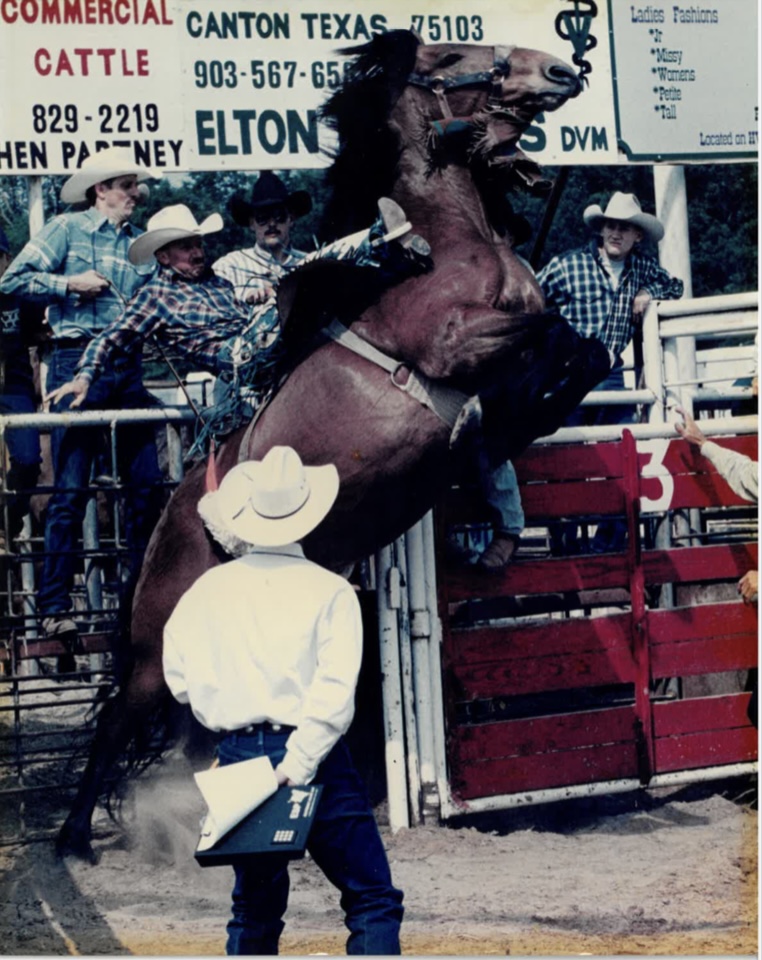 Brian Peterson riding saddle bronc horse