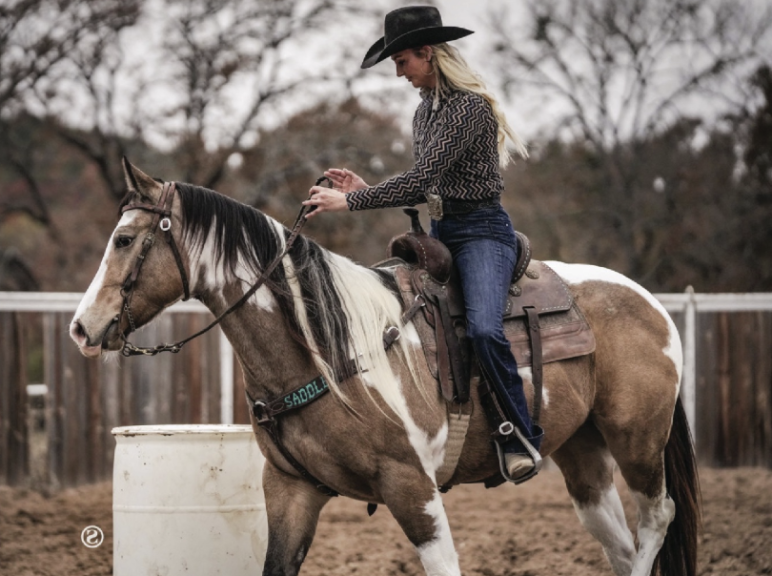 Maggie Carter putting the reins in the opposite hand
