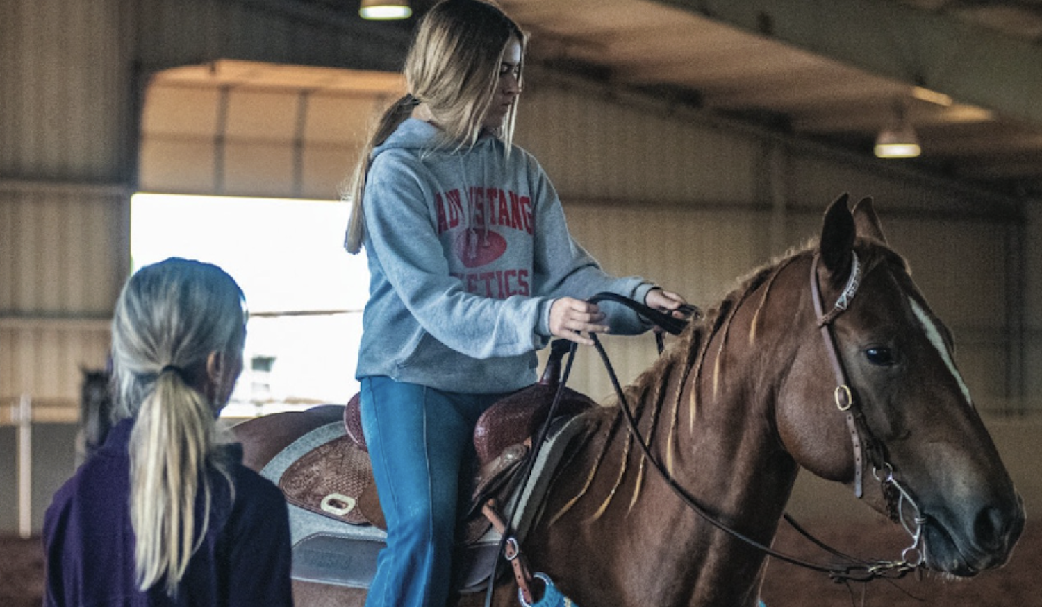 Charmayne helping a novice rider with her points around the turn